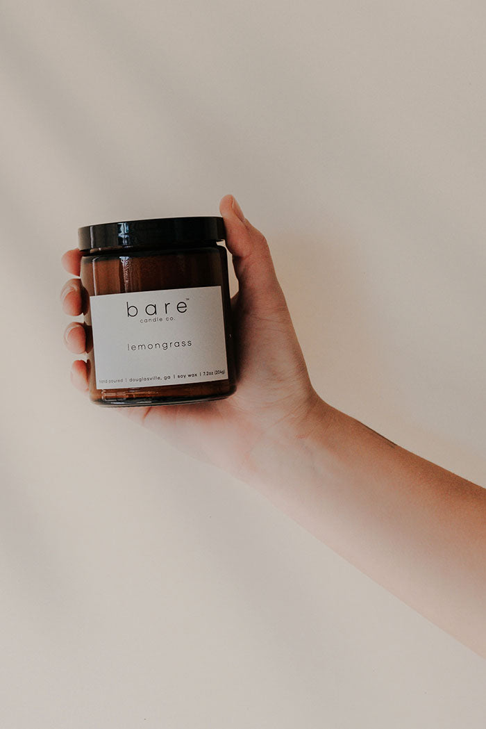 Holding a Lemongrass soy candle